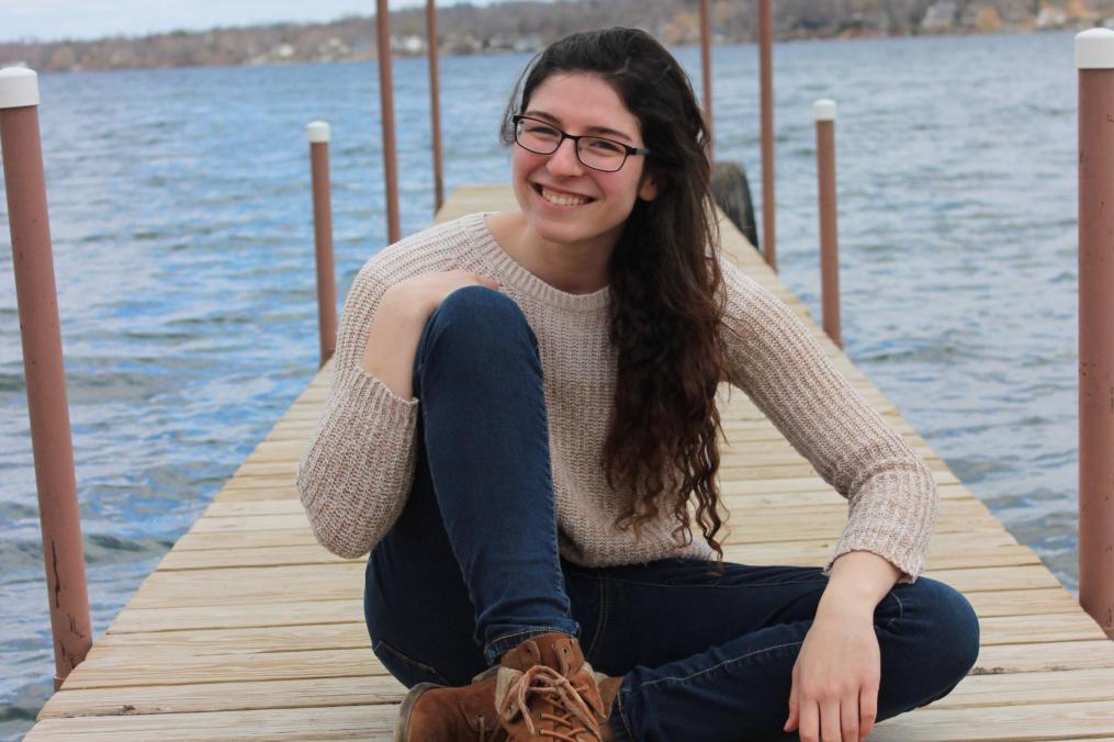 Ashley Knapp sits on the dock at Point Neamo