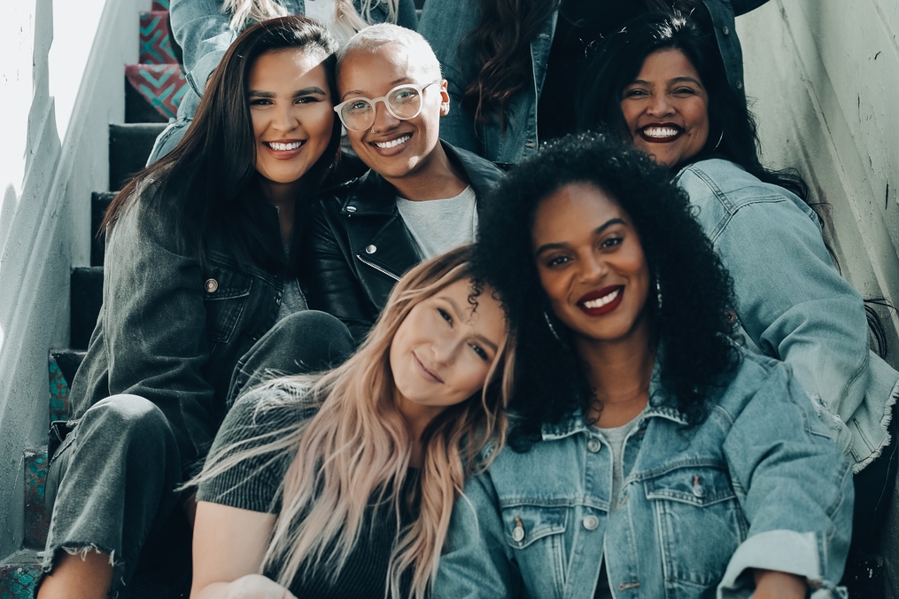 Group of women sitting on stairs posing