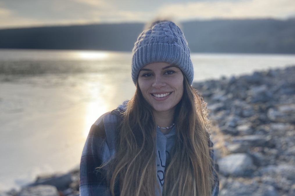 Danielle Bosche standing on the shore of a lake