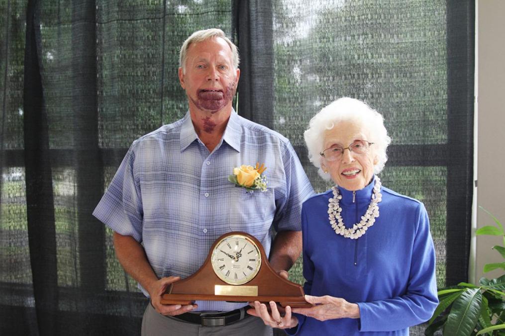 Norm Koek accepts the 2019 Stork Award from Corinne Stork. 