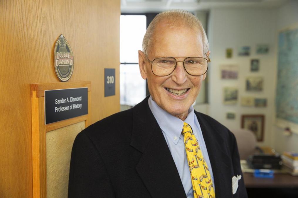 Dr. Sander Diamond on the threshold of retirement ... in his College office.